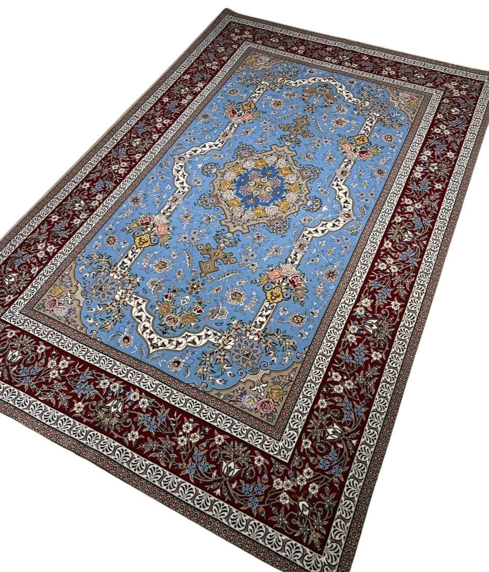 "Exquisite Isfahan carpet, 226 x 148 cm, showcasing hand-knotted floral patterns with luxurious silk and wool blend."